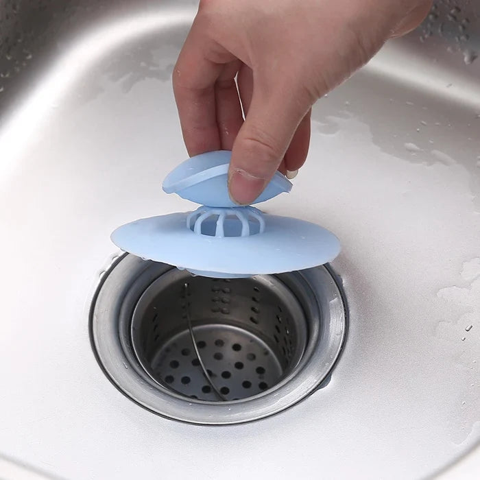 Someone is closing the sink with the help of the Silicone Sink Hair Strainer
