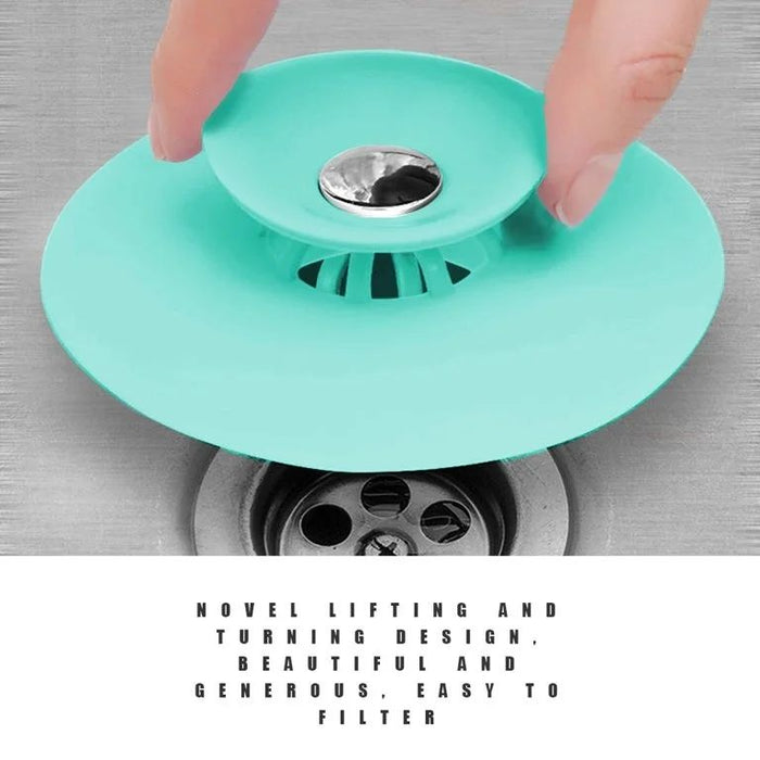 Someone is holding a Silicone Sink Hair Strainer for a basin