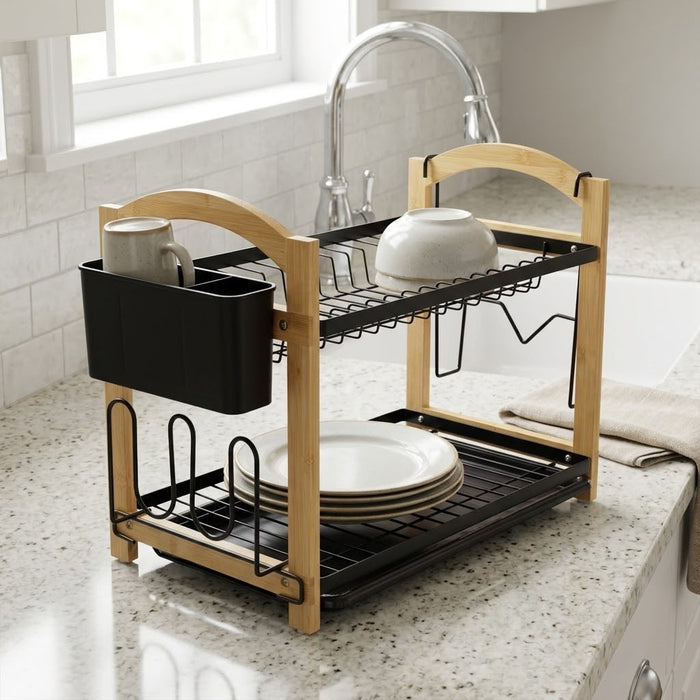 2 Tier Kitchen Dish Drying Rack on a kitchen countertop, holding white plates, a bowl, and a mug next to a sink.