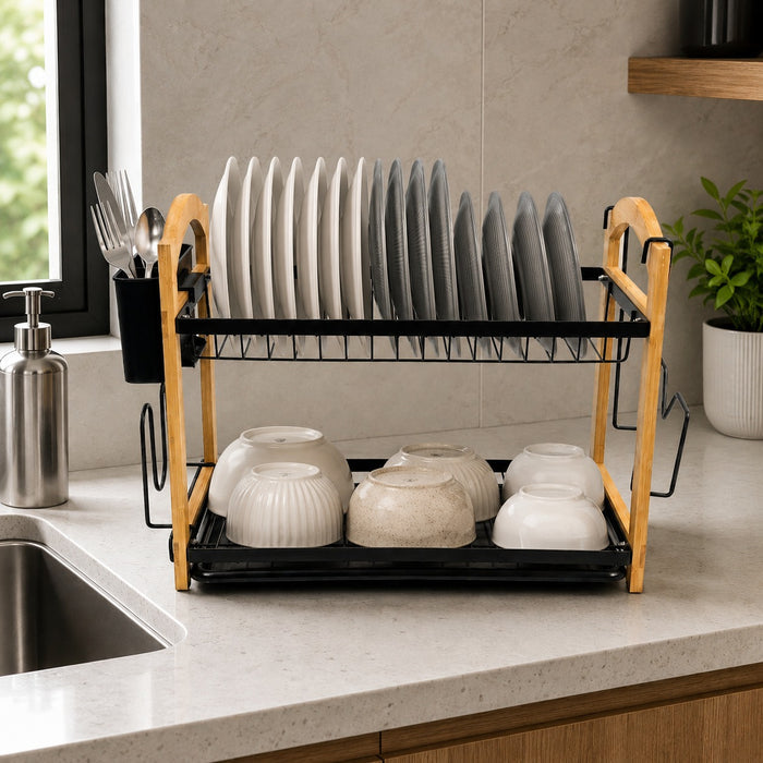 2 Tier Kitchen Dish Drying Rack on a kitchen countertop, holding upright white and gray plates on the top shelf and white bowls on the bottom shelf.