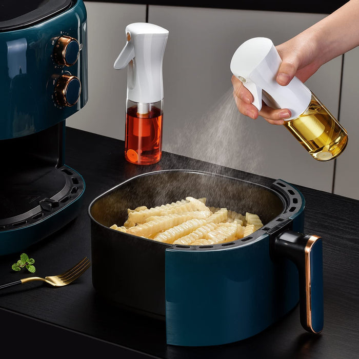 Someone is using a 200ml Kitchen Cooking Salad BBQ Oil Sprayer on food