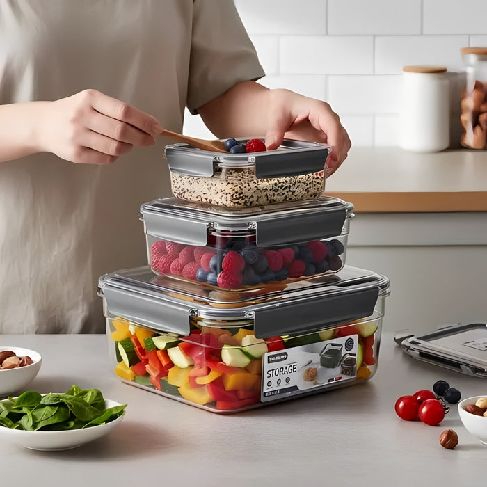 Person using a wooden spoon to add berries into a stack of 3-Piece Airtight Food Storage Container Set on a kitchen counter.