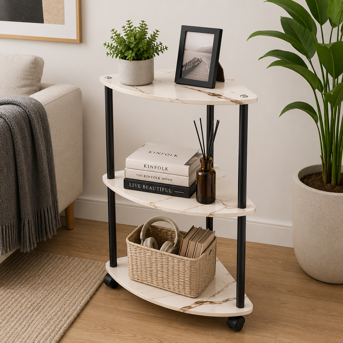 Three-tiered rolling side table with books, a basket, and decor items in a living room setting.