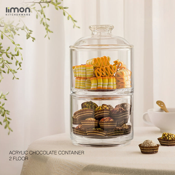 An Acrylic Chocolate Container With Snacks.