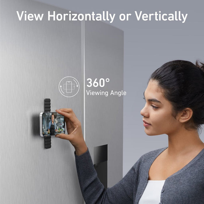 Anker MagGo magnetic phone holder attached to a refrigerator door, holding a smartphone.