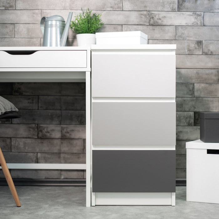 A set of drawers covered with various grey matte adhesive vinyl.