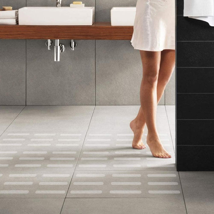 Clear anti-slip grip strips on bathroom floor