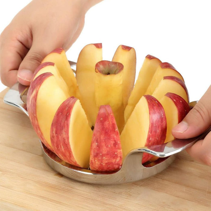 A Person is Cutting Apple Using Apple Cutter Slicer Corer.