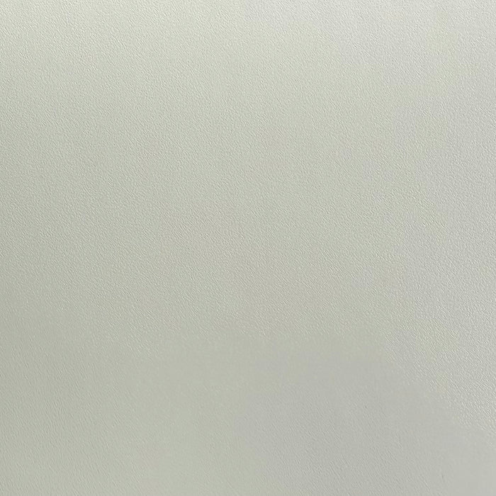 A close-up of an apricot grey textured adhesive vinyl.