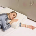 A Women is Sleeping on an Arched Couple Cuddle Pillow.