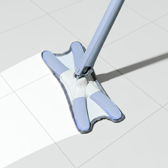 The white floor is being cleaned with an absorbent pad, which is part of the Aurora Twist Mop system.