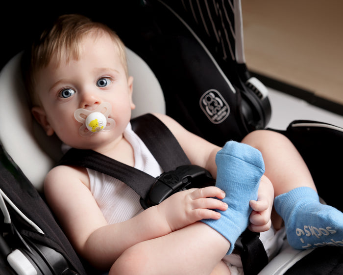 Chaney ankle socks: baby seated in a stroller wearing blue ankle socks. Squid Socks, the brand seen on Shark Tank.