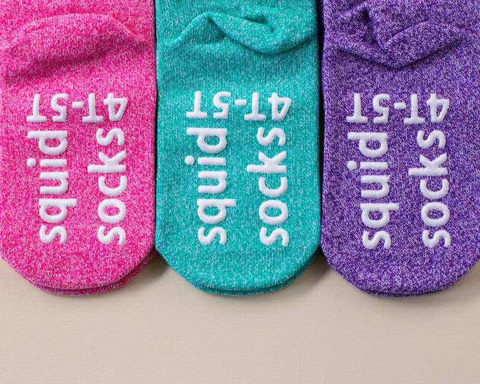 Clarissa ankle socks: pink, teal and purple ankle socks showing sole grips. Squid Socks, the brand seen on Shark Tank.
