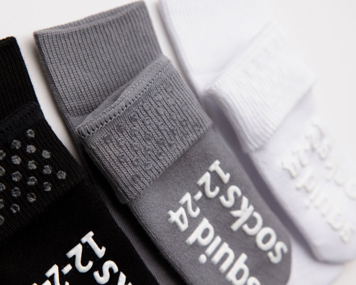 Casey cotton crew socks: close-up of cuff dots and sole grips on neutral crew socks. Squid Socks, the brand seen on Shark Tank.