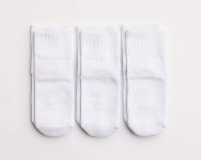 Dove cotton crew socks: three white cotton crew socks laid flat. Squid Socks, the brand seen on Shark Tank.