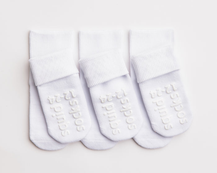 Dove cotton crew socks: three white crew socks with folded cuffs and sole grips. Squid Socks, the brand seen on Shark Tank.