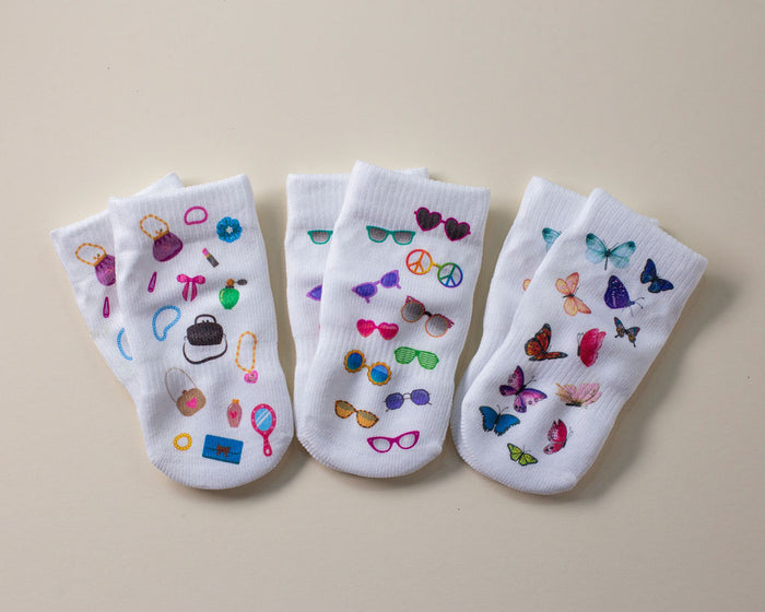 Caitlyn kids socks: three patterned socks arranged in a row. Squid Socks, the brand seen on Shark Tank.