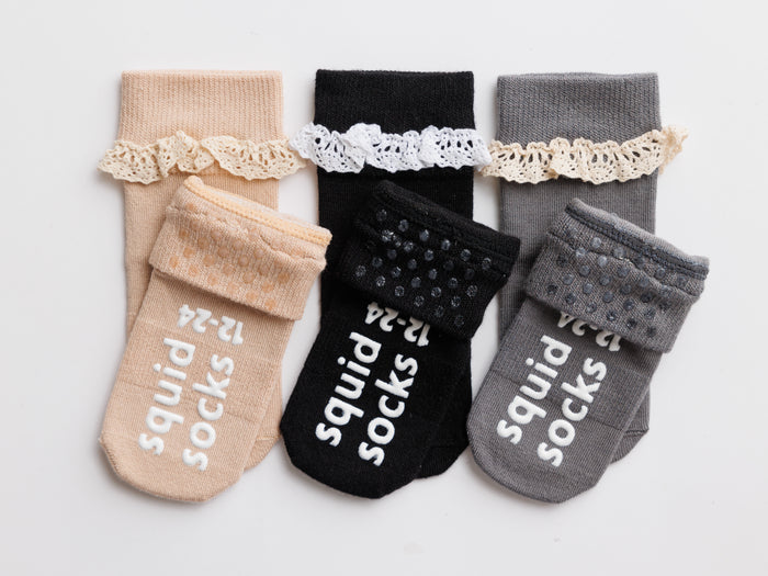 Candace kids socks: lace-trim socks showing cuff dots and sole grips. Squid Socks, the brand seen on Shark Tank.