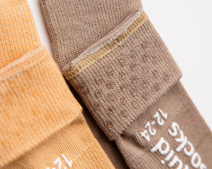 Caramel kids socks: close-up of brown cuff dots and sole grips. Squid Socks, the brand seen on Shark Tank.