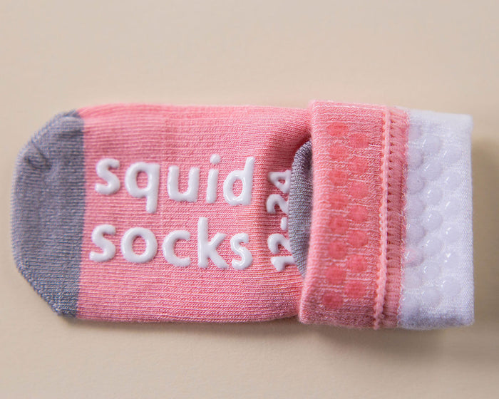 Caroline kids socks: pink color-block sock showing cuff and sole grips. Squid Socks, the brand seen on Shark Tank.