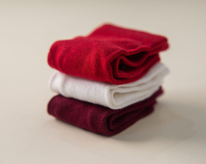Channing kids socks: red, cream and wine-colored socks stacked. Squid Socks, the brand seen on Shark Tank.