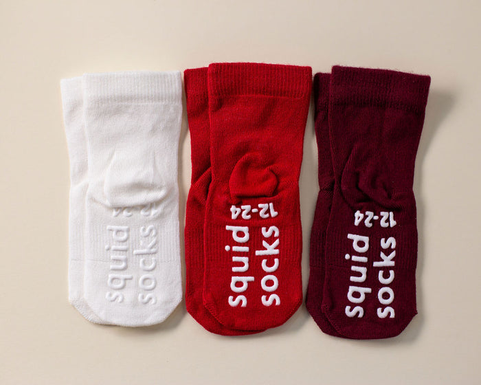 Channing kids socks: three socks in cream, red and wine showing branded soles. Squid Socks, the brand seen on Shark Tank.