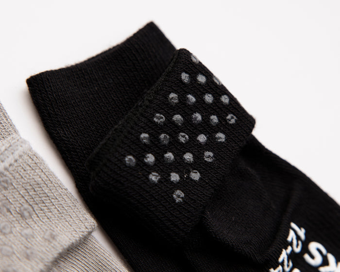Charlie kids socks: close-up of silicone dots inside a black cuff. Squid Socks, the brand seen on Shark Tank.