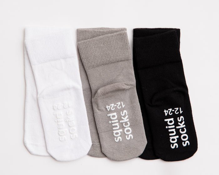 Charlie kids socks: three neutral socks with branded sole grips. Squid Socks, the brand seen on Shark Tank.