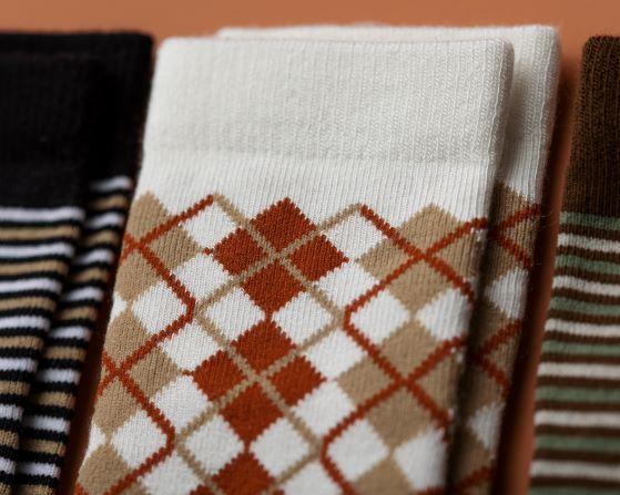 Chesney kids socks: close-up of white cuff and brown argyle pattern. Squid Socks, the brand seen on Shark Tank.