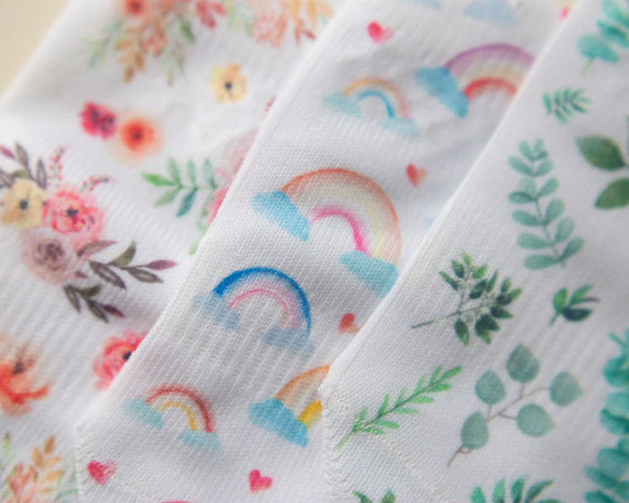 Chloe kids socks: close-up of floral, rainbow and green foliage prints. Squid Socks, the brand seen on Shark Tank.