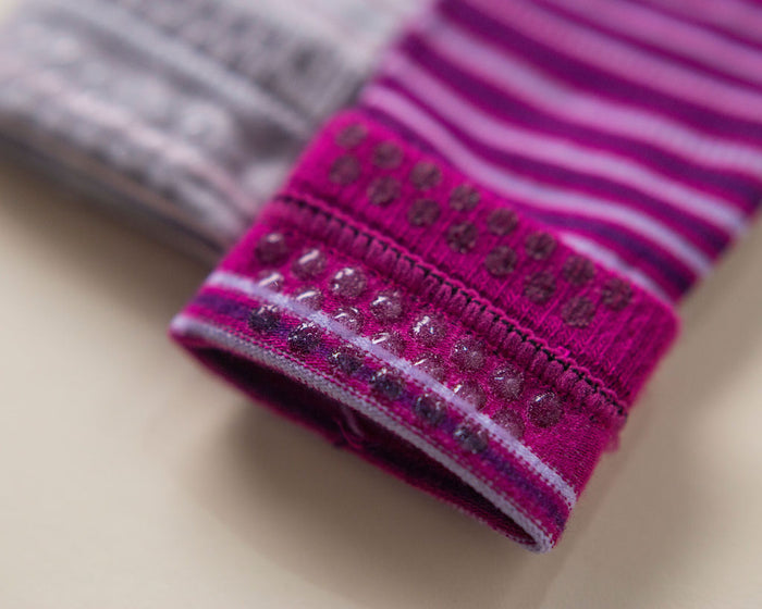 Christina kids socks: close-up of grip dots inside a magenta striped cuff. Squid Socks, the brand seen on Shark Tank.