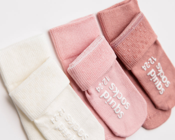 Claire kids socks: close-up of pink and rose cuff dots and sole grips. Squid Socks, the brand seen on Shark Tank.