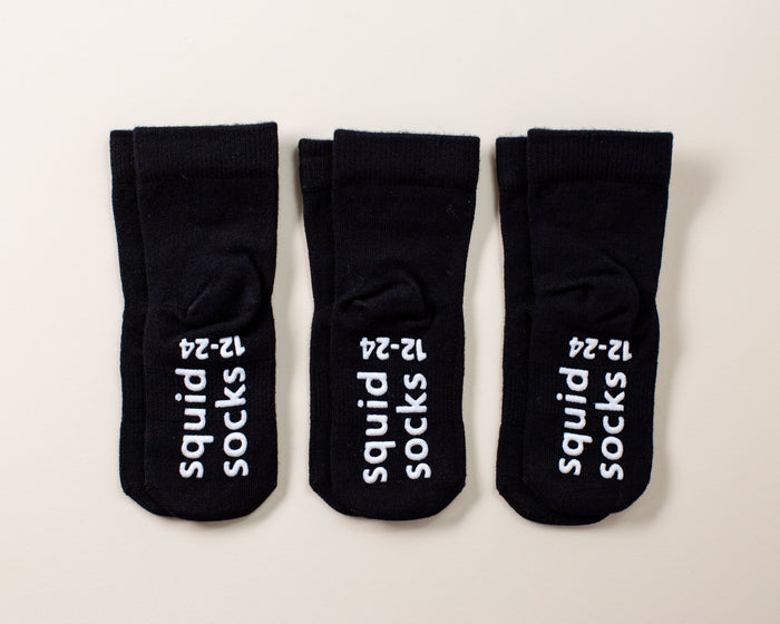 Coal kids socks: three black socks with branded sole grips. Squid Socks, the brand seen on Shark Tank.