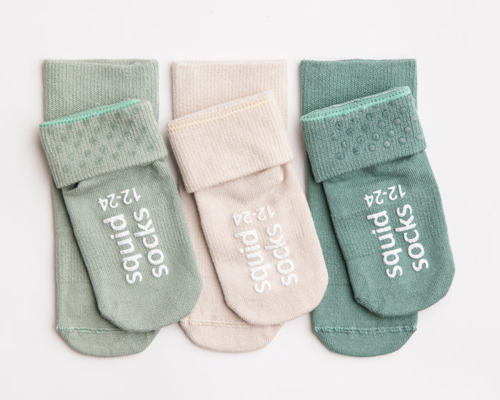 Coastal kids socks: three muted green and stone socks with folded cuffs. Squid Socks, the brand seen on Shark Tank.