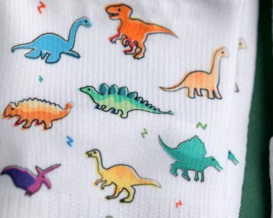 Cohen kids socks: close-up of colorful dinosaur print. Squid Socks, the brand seen on Shark Tank.
