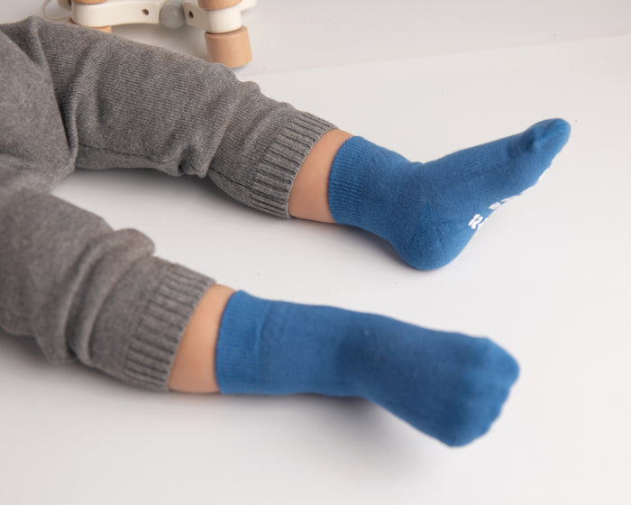 Colby kids socks: child wearing cobalt blue socks. Squid Socks, the brand seen on Shark Tank.