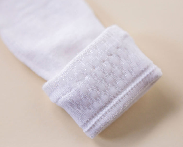 Comfort kids socks: close-up of silicone dots inside a white cuff. Squid Socks, the brand seen on Shark Tank.
