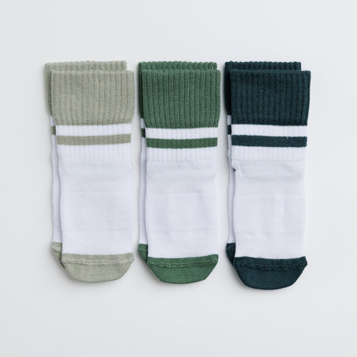 Cooper kids socks: three white socks with sage, green and dark teal cuffs and toes. Squid Socks, the brand seen on Shark Tank.