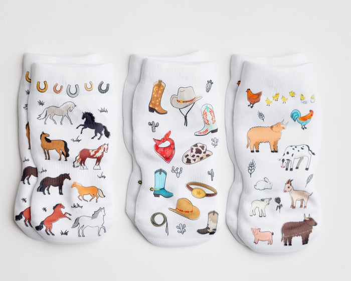 Cowboy kids socks: three socks with horse, western accessory and farm animal prints. Squid Socks, the brand seen on Shark Tank.