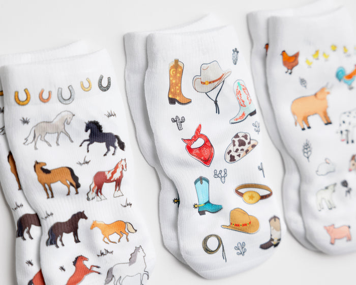 Cowboy kids socks: close-up of horse and western accessory prints. Squid Socks, the brand seen on Shark Tank.