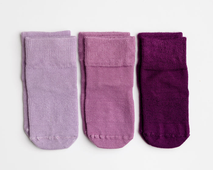 Orchid kids socks: three socks in dusty lavender, bright lavender and plum. Squid Socks, the brand seen on Shark Tank.