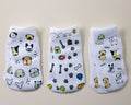 Woof kids socks: three socks with dogs, dog faces and pet toy prints. Squid Socks, the brand seen on Shark Tank.