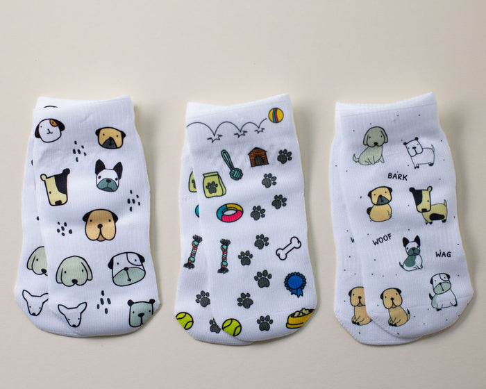 Woof kids socks: three socks with dogs, dog faces and pet toy prints. Squid Socks, the brand seen on Shark Tank.