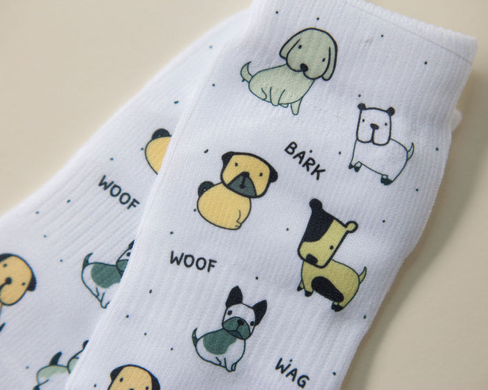 Woof kids socks: white socks with colorful dogs and bark lettering. Squid Socks, the brand seen on Shark Tank.