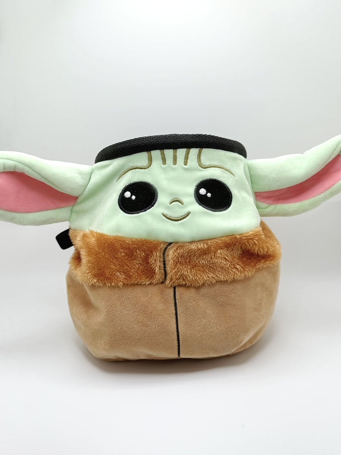 A cute anime plush chalk bag by Fatworm featuring the adorable Baby Yoda. This functional and fluffy green space baby accessory is handmade for bouldering and climbing for rock climbing, offering a long-durable design that makes the perfect climbing gift for a climber.
