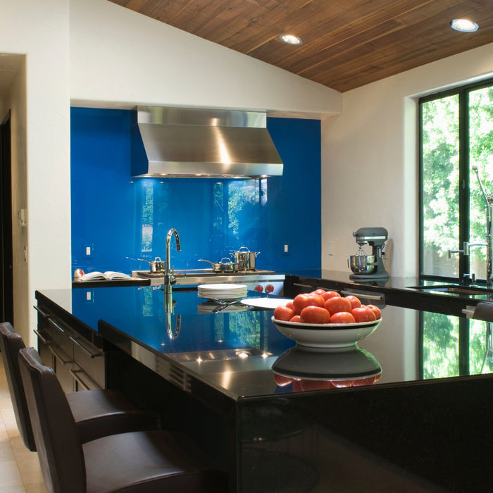 A kitchen that is black glossy.