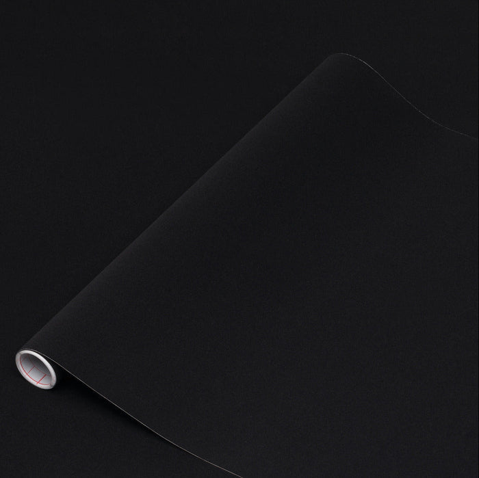 Roll of black velour on a black background