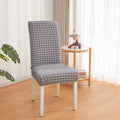 A Chair is Covered With Grey Bubble Stuff Stretchable Chair Cover