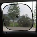 A Car Sun Shade is Fixed On Car Window.