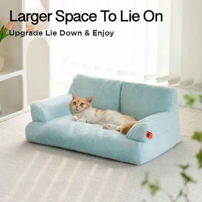 A cat lying on a blue color Cat Sofa Couch Cushion